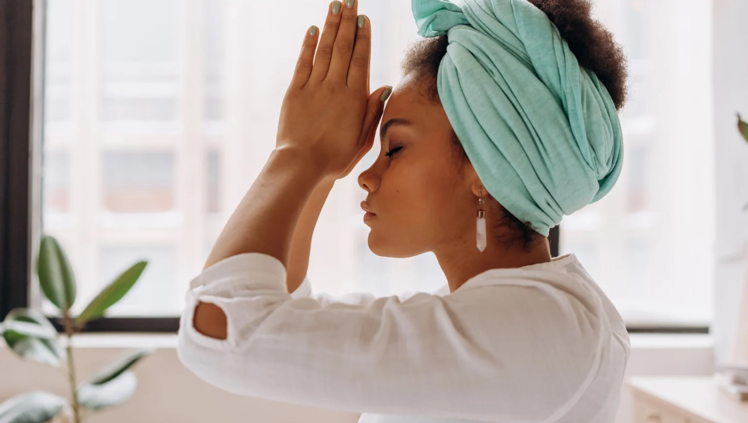 A serene figure meditating with radiant spiritual light and energy flow